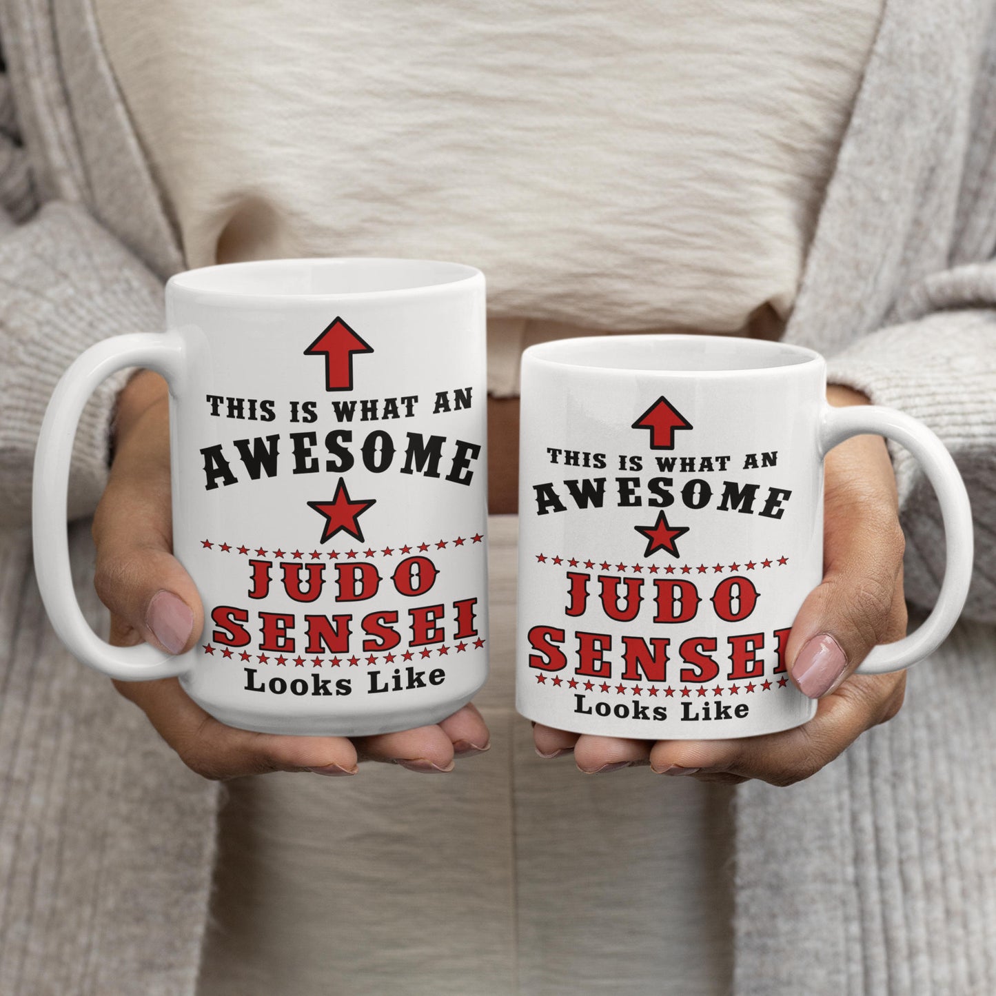 Judo Sensei mug shown in both 15oz and 11oz sizes, held side by side to compare size options