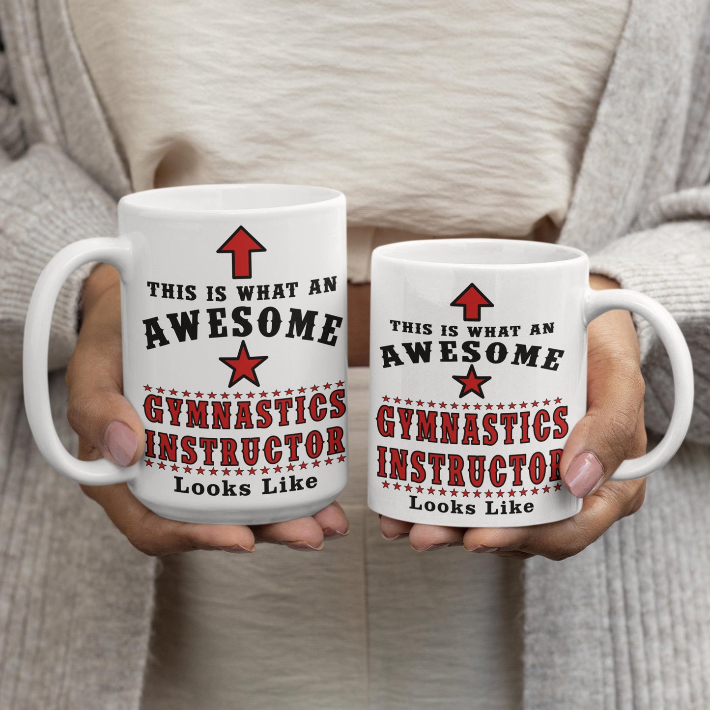 Woman holding two 'Awesome Gymnastics Instructor' mugs side by side, showing 15oz and 11oz size comparison
