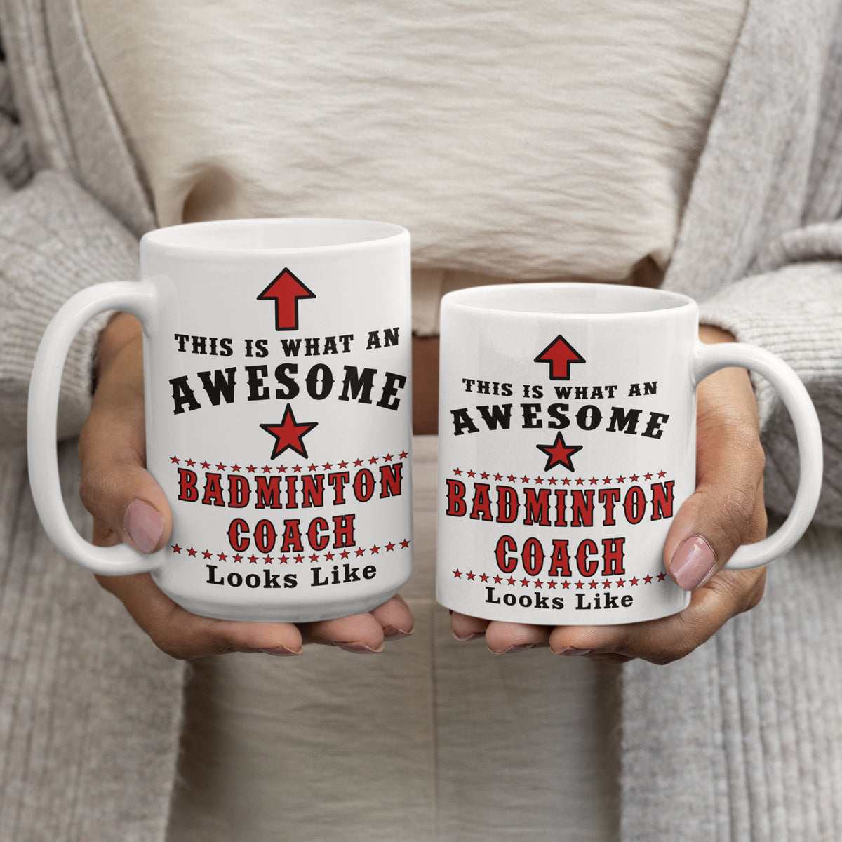 Two "Awesome Badminton Coach" mugs held in hands, 15oz and 11oz size comparison