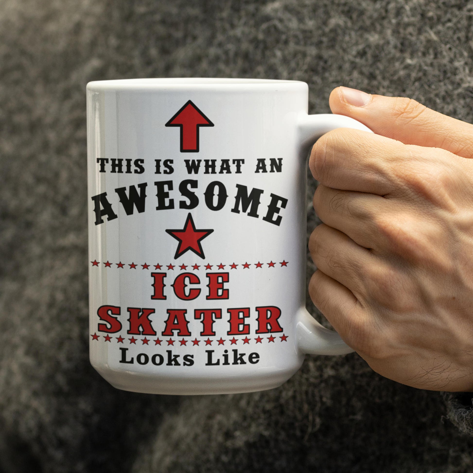 Close-up of a hand holding a white 15oz mug printed with "This Is What An Awesome Ice Skater Looks Like" ice skating design