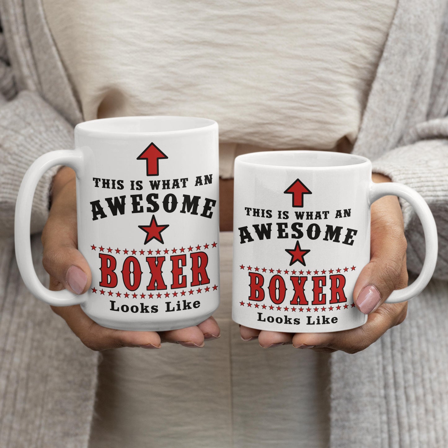 Two white ceramic mugs printed with "This Is What An Awesome Boxer Looks Like" in red and black text, held side by side showing 15oz and 11oz size options